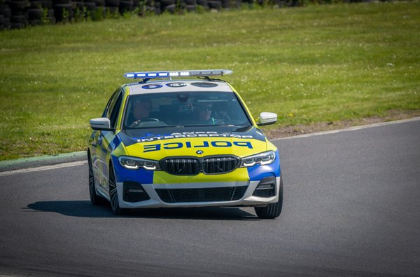 What are the specific considerations for maintaining a UK police car's performance standards?